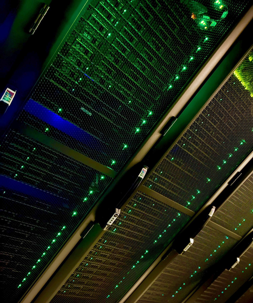Rack of servers with green lights.
